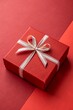 © Anastasiia Kasina - Red gift box on the red background. Copy space, top view