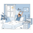 © Aleena - Man stretching in bed waking up in sunlit bedroom, morning routine, healthy lifestyle