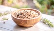 © Domurigu - Close-up of a Rustic Wooden Bowl Brimming with a Nourishing Bird Seed Mix, Set Outdoors