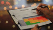 © Piya W. - Serious manager checking operational report with caution planning safety strategy risk assessment clipboard with matrix chart.