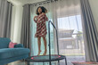 © Kwangmoozaa - Young Asian Girl Exercising by Jumping on a Mini Trampoline Indoors