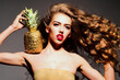© Volodymyr - Woman luxury portrait with golden pineapple. Woman glamorous beauty fashion concept. Woman exotic tropical luxury style. Woman modern aesthetic visual.