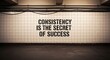 © Syafiq - Inspiring message 'Consistency is the Secret of Success' stenciled onto a tiled wall in an urban underground setting