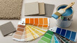 © Vertstyle - Paint color samples, fabric swatches and open paint can for interior design