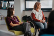 © Halfpoint - Teen students talking together in inclusive school setting.