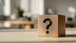 © Tetyana - Wooden cube with an engraved question mark, representing uncertainty, critical thinking, problem solving, and the search for answers in business and education, copy space
