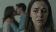© Maryia - Sad woman experiencing relationship rupture while couple kisses in background symbolizing emotional betrayal inner suffering jealousy loss of connection and quiet heartbreak