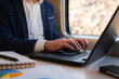 © Cristian Blázquez - Businessman working on laptop during train travel