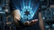 © isma01 - Hand holding glowing blue recycling symbol.
