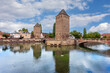 © Sergey - The covered bridges of Strasbourg form a set of three bridges spanning the Ill river in the heart of the Petite France district. Strasbourg, Alsace, France