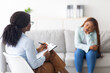 © Prostock-studio - Depressed black lady receiving professional psychological help at mental clinic, selective focus. Female psychotherapist having session with desperate Afro lady wih ptsd or emotional trauma