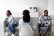 © Prostock-studio - Back view of female psychologist consulting young black couple at office, helping them solve family conflict, selective focus. Marital counselor working with African American family at clinic