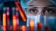 © Oleh - Female scientist in protective eyewear and mask examines glowing red test tubes in a dark modern lab, focused on medical research, diagnostics and biotech discovery