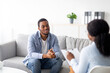 © Prostock-studio - Effective psychotherapy. Young black guy talking to his psychologist, receiving professional help at mental health clinic. African American male patient sharing therapy results with counselor