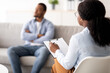 © Prostock-studio - Young black man with mental problem having session with psychotherapist at medical office, selective focus. African American male patient receiving professional psychological help, copy space