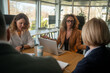 © Nenad - Businesswoman disappointed with team performance during stressful office meeting