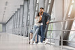 © Prostock-studio - Couple In Airport. Full Lenght Shot Of Happy Middle Eastern Spouses Standing In Terminal, Romantic Young Arab Man And Woman With Suitcases And Passports In Hands Waiting For Flight, Copy Space