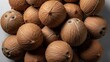 © thenort - A close-up view showcasing a pile of coconuts with their rough, fibrous exteriors
