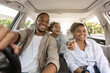 © Prostock-studio - Auto Purchase. Joyful Black Family Having Road Trip Sitting In New Car Enjoying Summer Weekend Together. Parents And Daughter Riding Across City Traveling By Automobile. Selective Focus