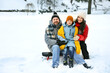 © New Africa - Portrait of happy family outdoors on winter day, space for text