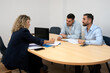 © Carmen - Lawyer advising gay couple during legal consultation