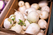 © JackF - Basket filled with ripe turnips on display at market. Shoppers are offered fruits and vegetables from around the world