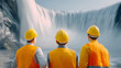 © Jiajia - Three engineers in hard hats and safety vests looking at a massive waterfall power project
