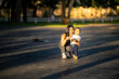 © Wasana - Asian mother and toddler son smiling in park