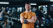 © peopleimages.com - Fitness, portrait or man in gym with arms crossed, pride or progress in physical exercise. Happy, space or athlete in center with confidence, training break or workout results in body improvement.