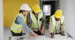 © peopleimages.com - People, architect and blueprint with team at meeting, writing and point with solution for building. Group, contractor and engineer with floor plan, talk and insight at property development company