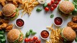 © Roman - Fast food frame with burgers fried chicken french fries and sauces around blank copy space center