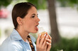 © svetograph - Icecream Woman Outdoor Licking: Girl enjoys summer dessert outside for pleasure in daytime.