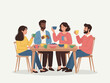 © Vooglo.com - Group of friends sitting around a table eating and drinking together