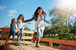 © BuyoutReese05/peopleimages.com - Playing, children and bale of hay, girls and bonding together with weekend break, fun and laughing. Outdoor, friends and kids with summer holiday, relax or smile with adventure, nature or countryside