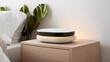 © Preecha - A smart home assistant device glowing softly on a nightstand, representing technological convenience
