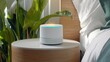 © Preecha - A smart home assistant device glowing softly on a nightstand, representing technological convenience