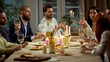 © Lustre Art Group  - Group of friends raising wine glasses at cozy dinner table. Concept of social gathering, lifestyle communication, wine promotion, restaurant marketing, friendly celebration.