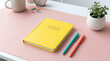 © Praphapan - Workspace notebook desk pen office pink yellow minimal succulent plant stationery writing study learning organization planning productivity