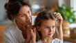 © Denis Yevtekhov - Faceless mother gently combing daughter's hair in soft morning light at home, tender moment, parent-child grooming, family care activity, defocused faces, with copy space