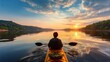 © Musa - Kayaker on calm water at sunset scenic view with dramatic sky