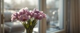 Charming bouquet of purple eustoma flowers in vase near window with space for message