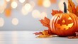 © Dmitry - A carved pumpkin with a smiling face sits on a white wooden table, surrounded by autumn leaves.