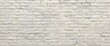 © ArtificialHorizons - Cream hues and white brick wall art featuring concrete stone texture background in wallpaper, limestone abstract paint, flooring, and homework brickwork or stonework with clean grid, uneven interior