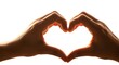 © AhmadMuslih - Warm light illuminates two hands crafting a tender heart shape symbol