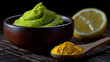 © Mselected - Green condiment and yellow spice on a wooden table with lemon