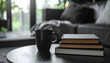 © Trio - Coffee cup and books on table in cozy living room with copy space