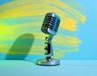 © eryto - A retro silver microphone stands against a vibrant blue backdrop with yellow paint strokes, creating a colorful and dynamic composition
