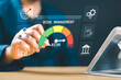 © Nirusmee - Businessman managing and assessing investment risks, focusing on risk control, forecasting, estimation, and financial strategy for effective business management.