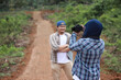 © airdone - Young Asian couple in flannel shirts and jeans enjoying an outdoor adventure