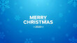 © Lensory - A blue Christmas background with snowflakes and Merry Christmas 2020 text